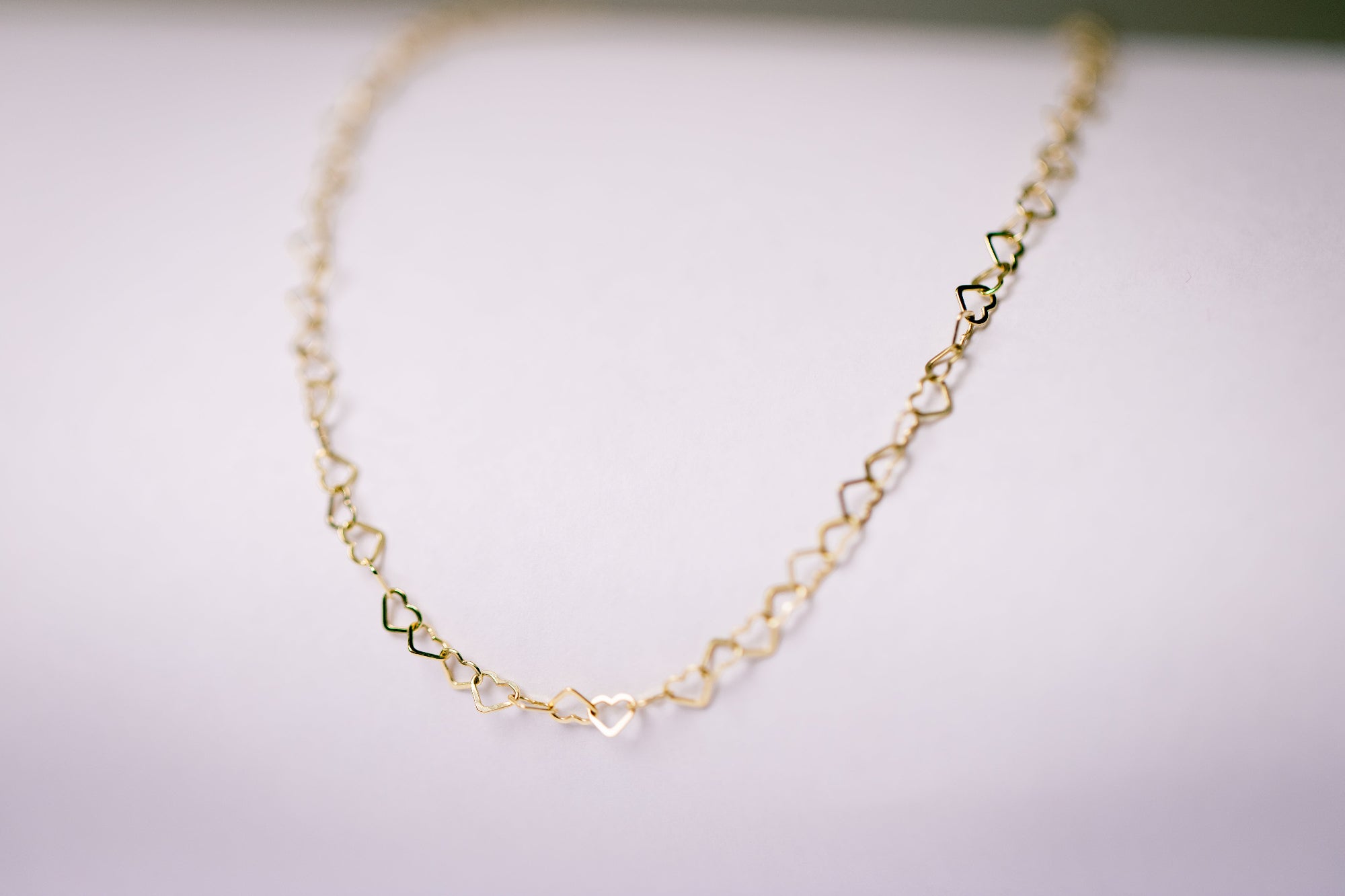 Elegant gouden collier met hartjes - Lara Boulangerie
